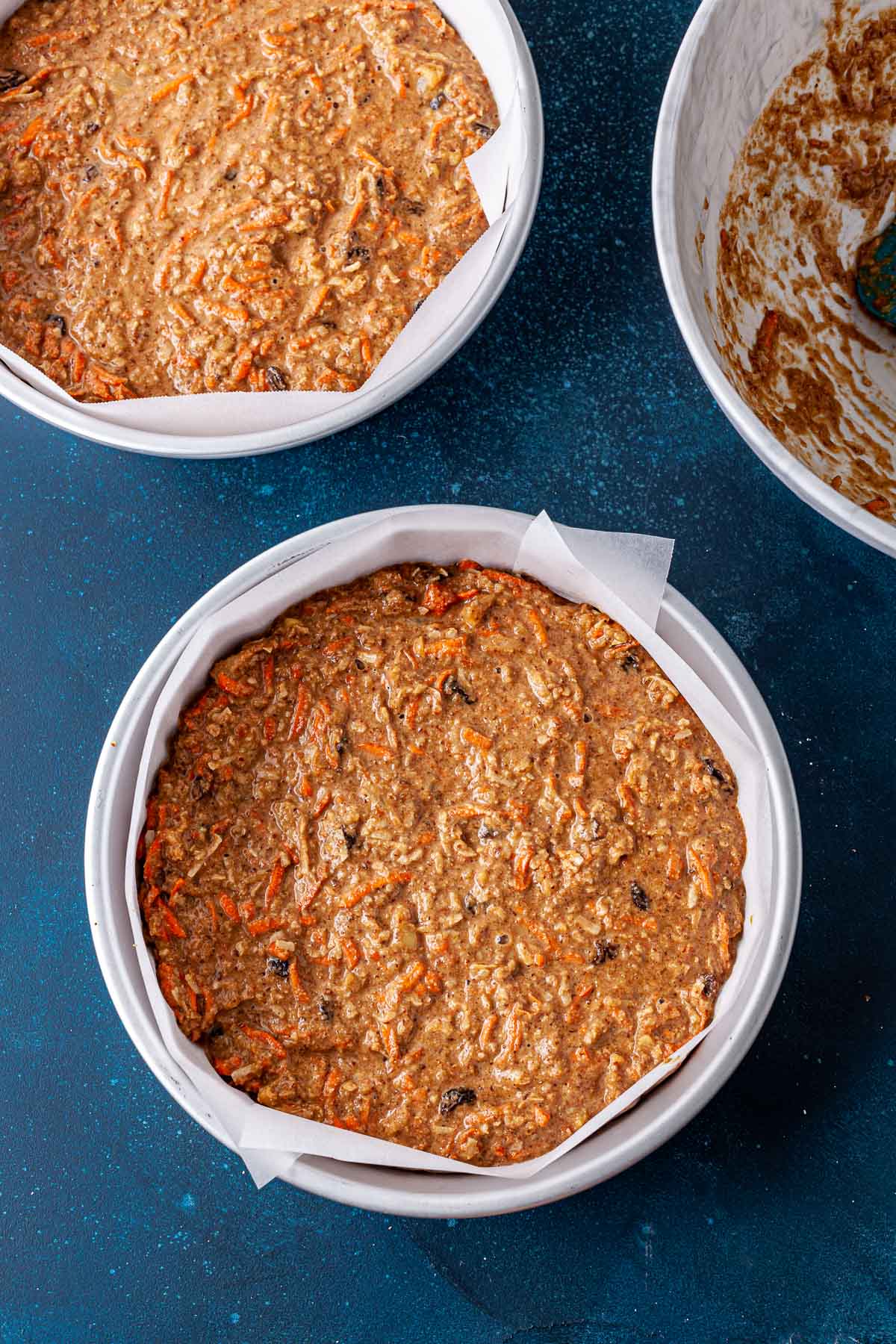 Oil-free vegan carrot cake in round pans before being baked.