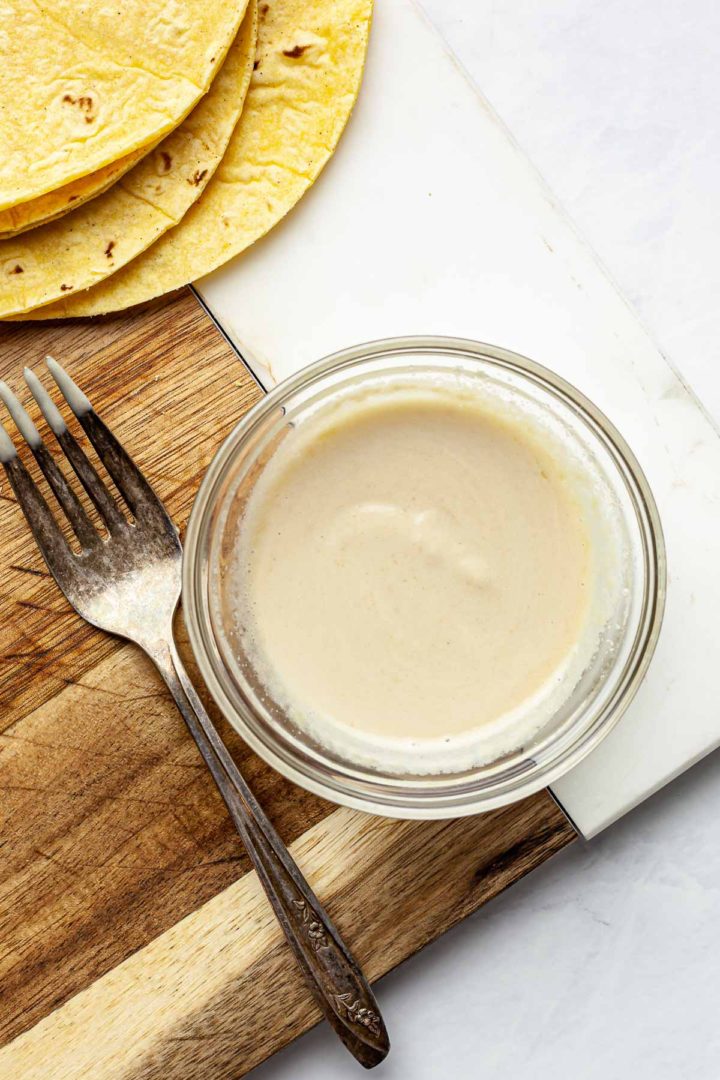 Tahini and water mixed together in a small bowl until creamy.